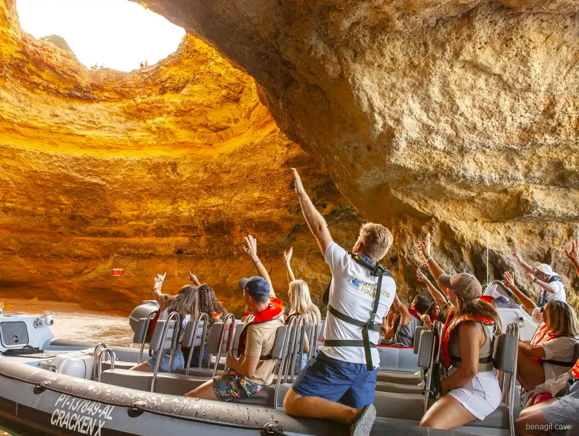 Golden skylight inside Algar de Benagil seen from a Portimao boat tour