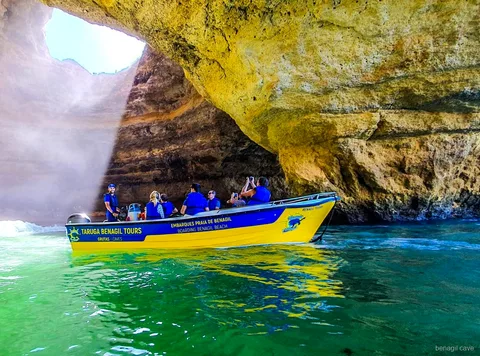 Boat departing Benagil Beach on the Benagil Cave express tour