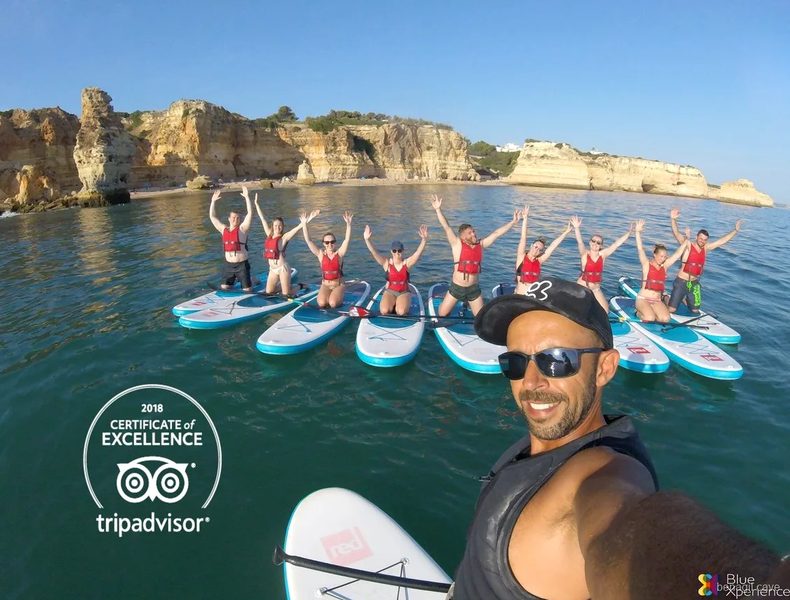 Paddleboard group inside a sea cave near Benagil on the guided tour